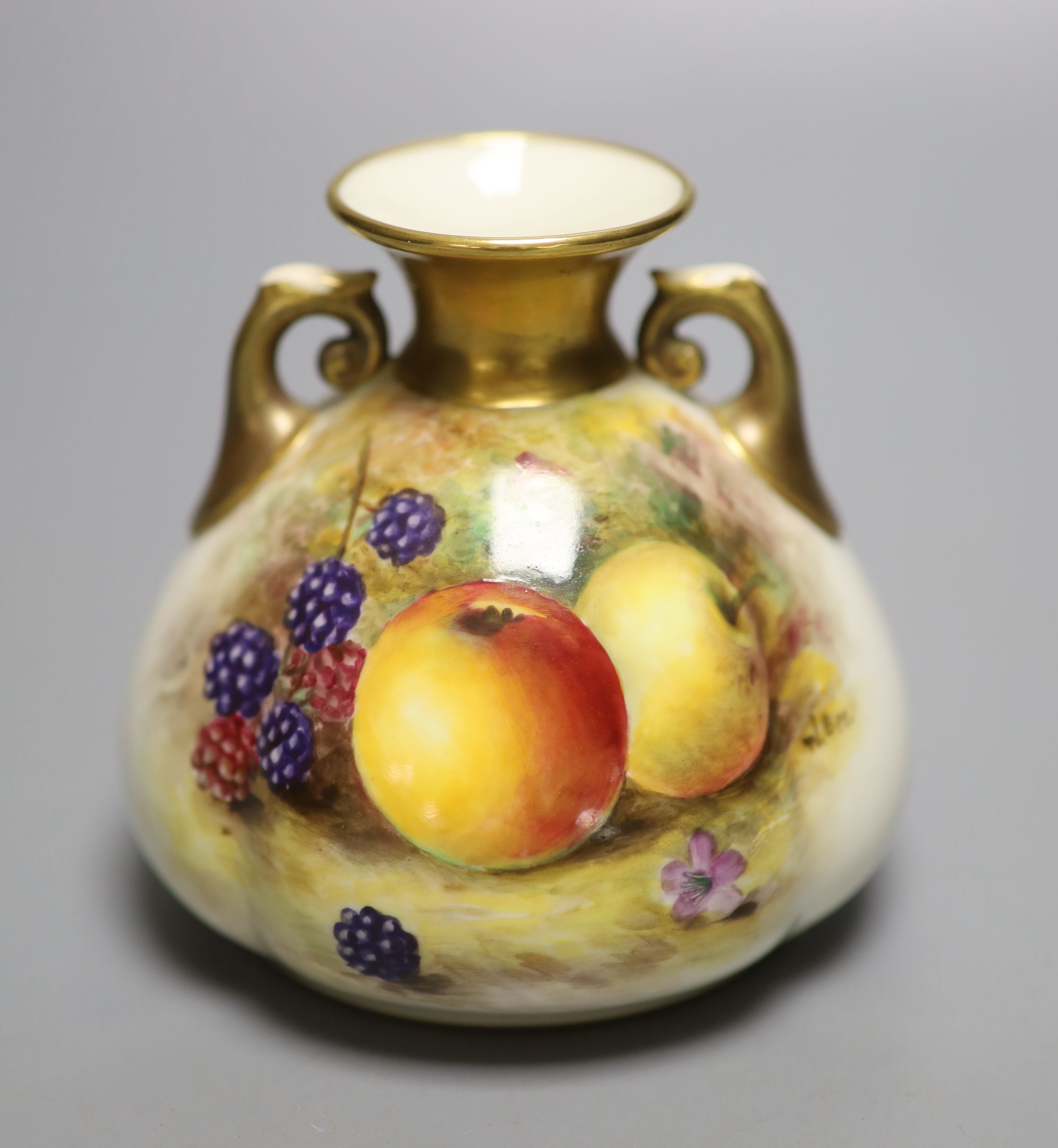 A Royal Worcester two handled vase, painted with fruit and berries by W. Bee, signed, date mark 1926